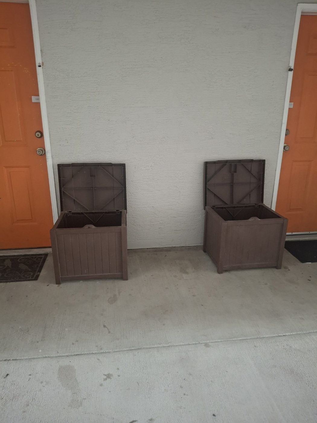 Valet trash bins at neighboring apartment doors